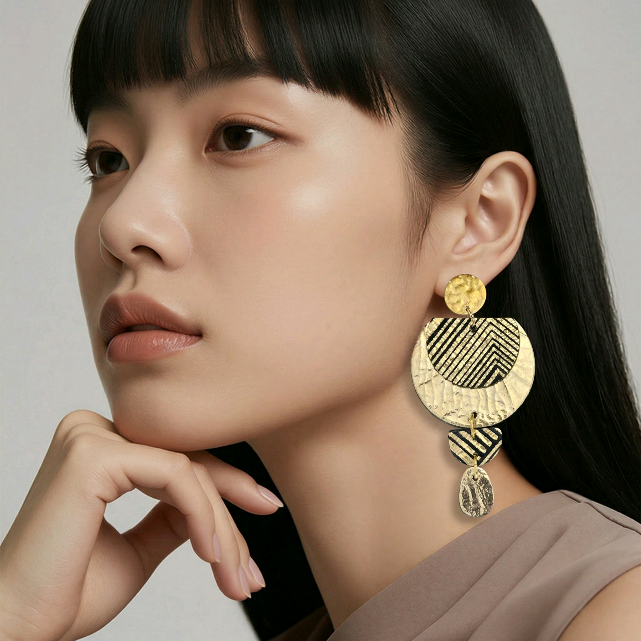 Boucles d'oreilles Glow en cuir doré (1)